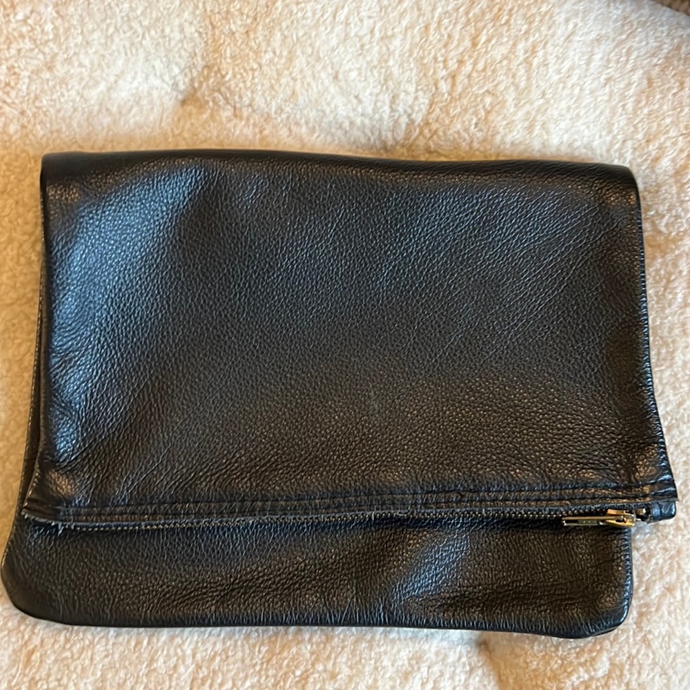 Pebbled leather fold clutch with brass zipper